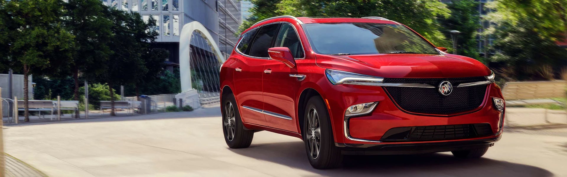 Red Buick Enclave in the center of a city
