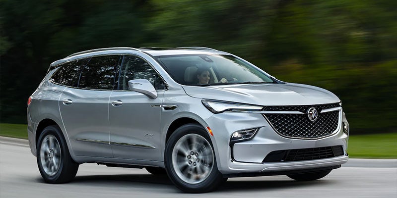 A Buick Enclave driving down the road