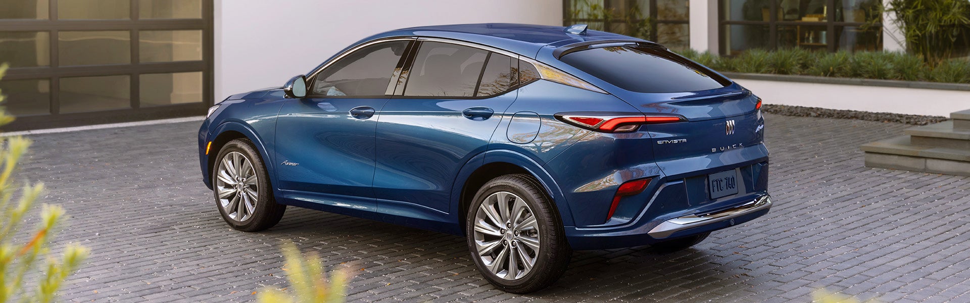 2024 Buick Envista sitting nearby a house
