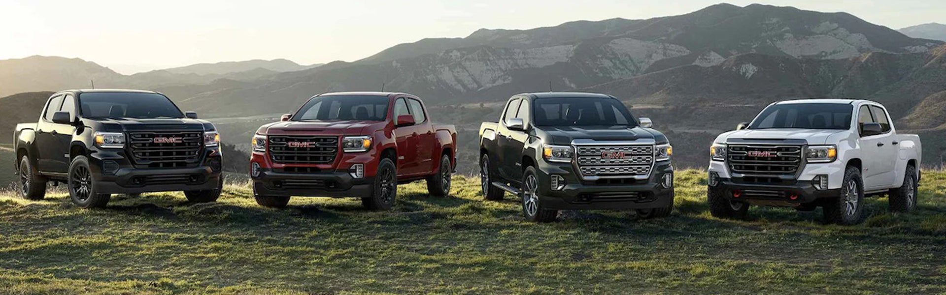 4 2022 GMC Canyon vehicles by the side of the cliff