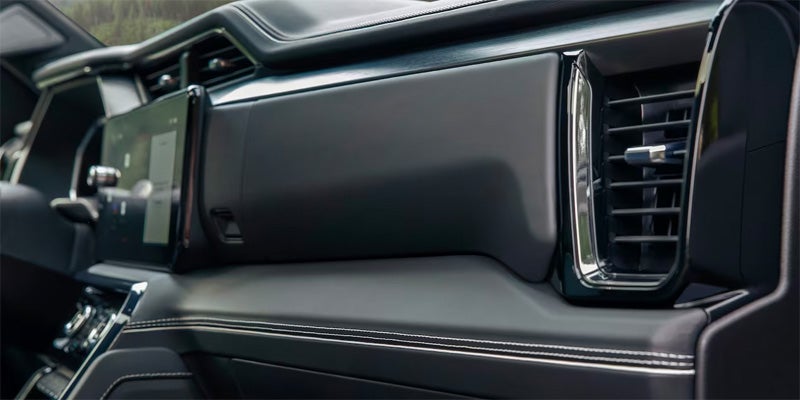Close up view of the glove box compartment of a 2024 GMC Sierra 1500