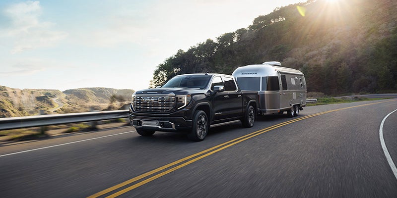 2024 GMC Sierra 1500 with a camper ready to go on a drive