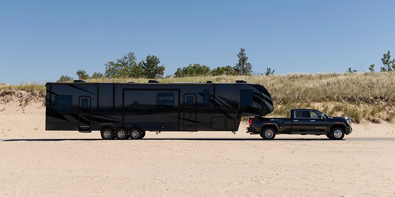 GMC Sierra outside on the desert hitching a camper