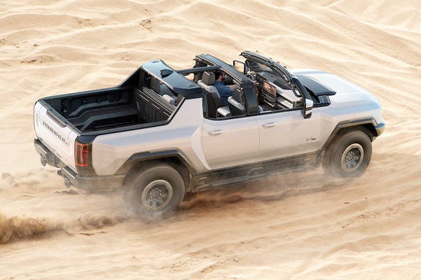 A 2022 hummer EV going through a desert
