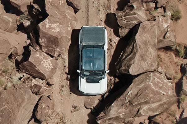 A 2022 hummer EV going through a canyon